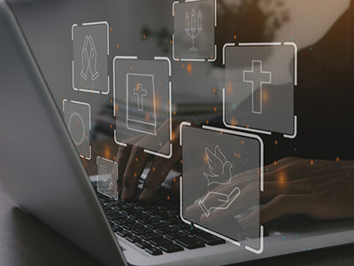 A man on a laptop with graphics references church and religion floating in front of it 