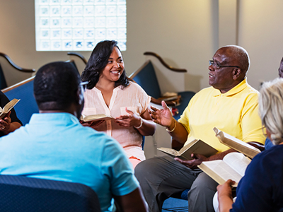 Group of people studying the bible in their church together