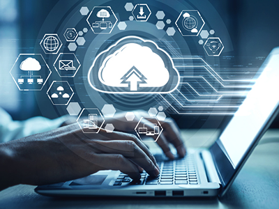 Graphic of Cloud technology super-imposed over a laptop