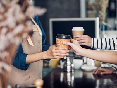 Faceless customers receiving their coffee orders from a faceless server